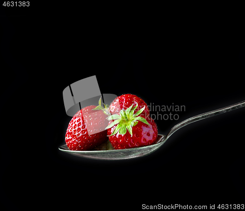 Image of spoon of fresh strawberries