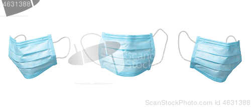 Image of Flying set from three medical masks as a protection on a white background.