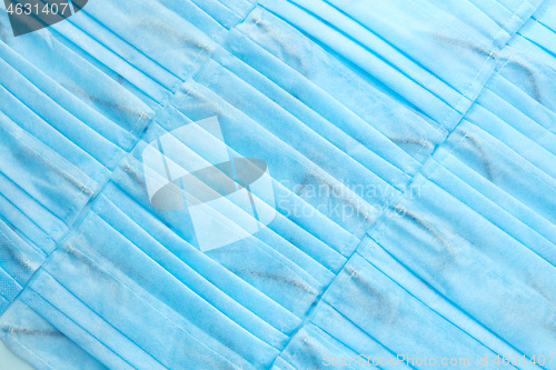 Image of Medical masks diagonally arranged as a background. Top view.
