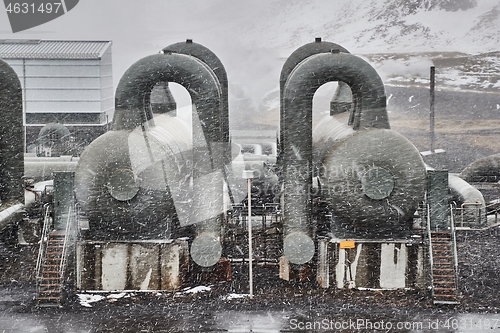 Image of Geothermal power plant in falling snow storm