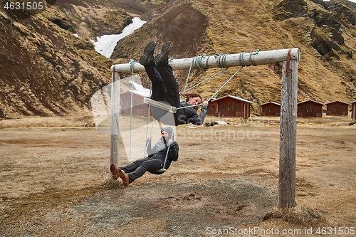 Image of Using swings in Iceland