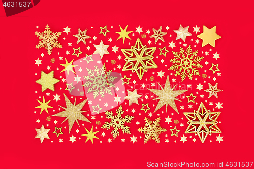 Image of Sparkling Christmas Gold Star and Snowflake Background