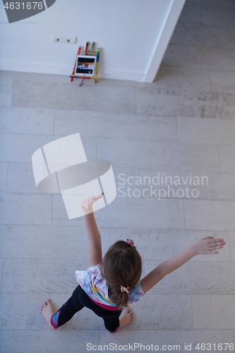 Image of girl online education ballet class at home top view