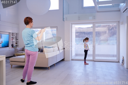 Image of family at home little girl have online ballet training