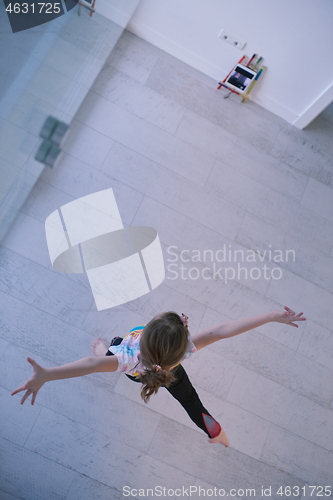 Image of girl online education ballet class at home top view
