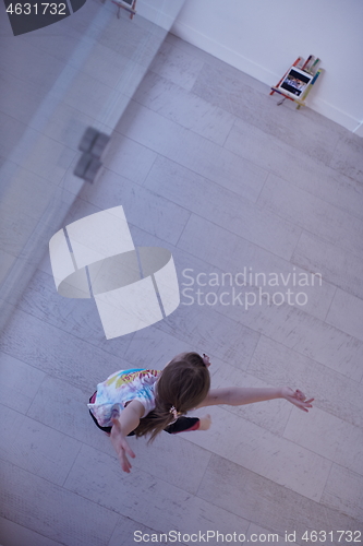 Image of girl online education ballet class at home top view