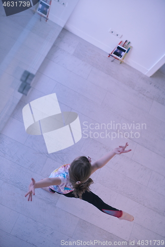 Image of girl online education ballet class at home top view