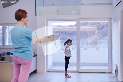 Image of family at home little girl have online ballet training