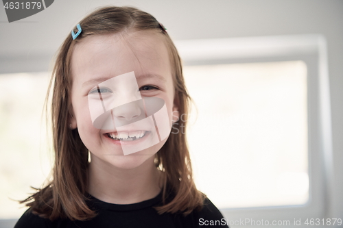 Image of little girl without tooth smiling