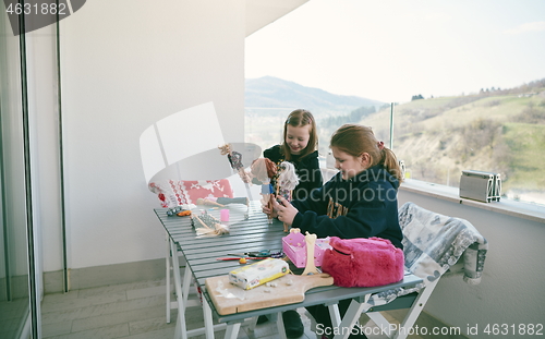 Image of little girls playing with dolls