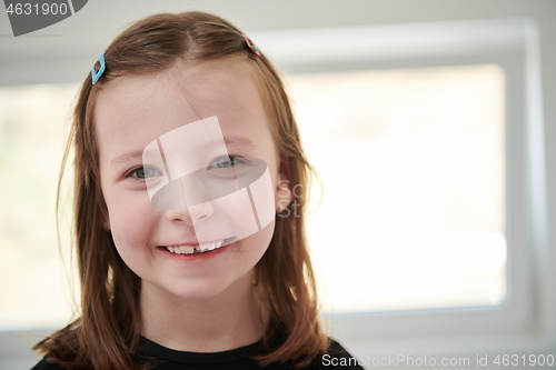 Image of little girl without tooth smiling