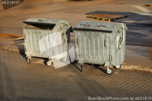 Image of Garbage Containers in a urban area