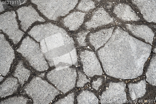 Image of Stone pavement broken near construction