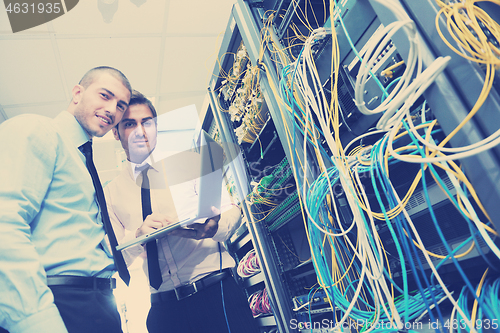 Image of it enineers in network server room