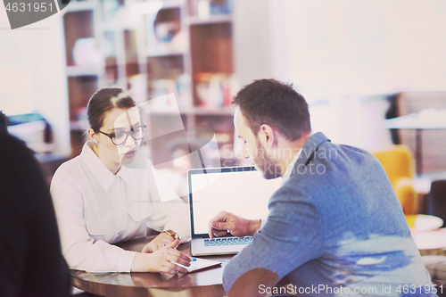 Image of Business team Working With laptop in creative office