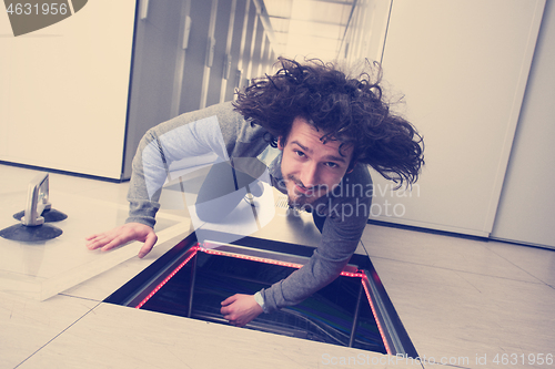 Image of engineer connecting cables in server room