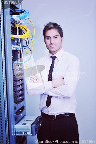 Image of young it engineer in datacenter server room