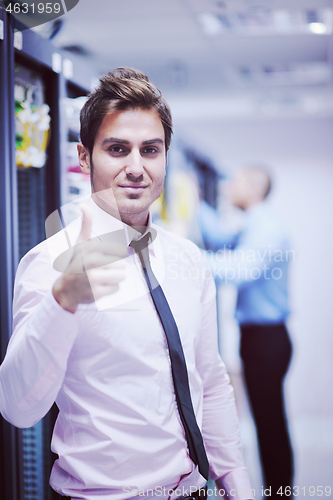 Image of it engineers in network server room