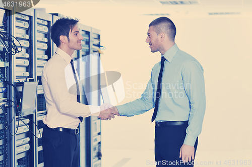 Image of it engineers in network server room