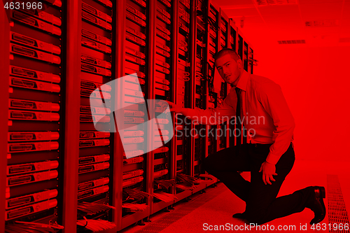 Image of young it engineer in datacenter server room