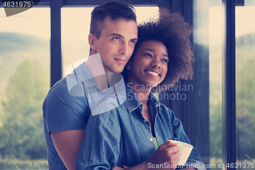 Image of romantic happy young couple relax at modern home indoors