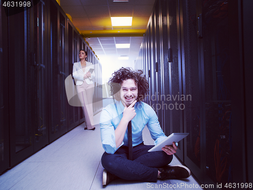 Image of young technicians working together on servers