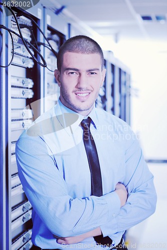 Image of young it engeneer in datacenter server room