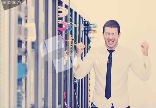 Image of young it engeneer in datacenter server room