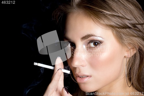 Image of portrait of the beautiful young woman with a cigarette 1