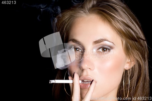 Image of portrait of the beautiful young woman with a cigarette 2