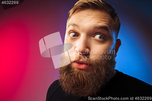 Image of The young attractive man looking suprised