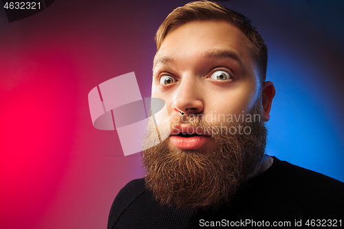 Image of The young attractive man looking suprised