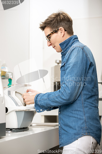 Image of woman hone the edge of the eyeglasses