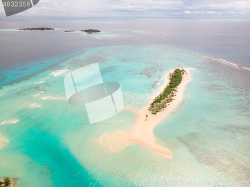 Image of Picture perfect beach and turquoise lagoon on small tropical island on Maldives