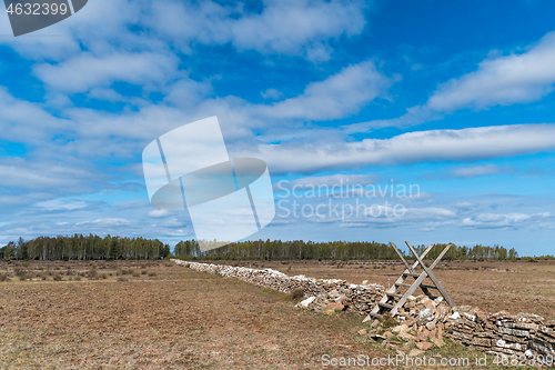 Image of Old wooden stile by a boundry