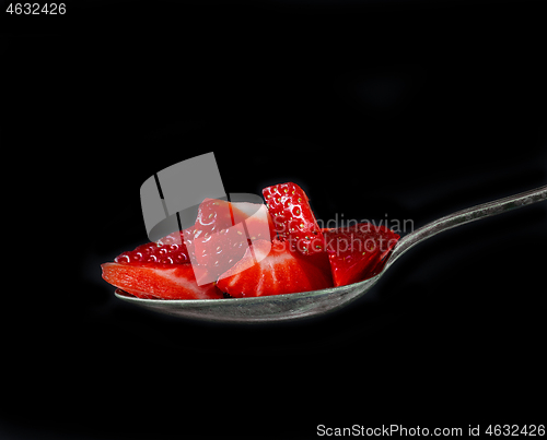 Image of spoon of strawberry pieces