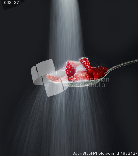 Image of spoon of strawberry pieces