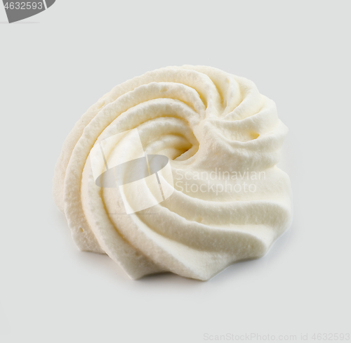 Image of whipped cream on light grey background