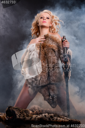 Image of Woman In Fur With Sword