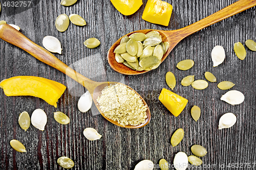 Image of Flour and seeds pumpkin in spoons on board top