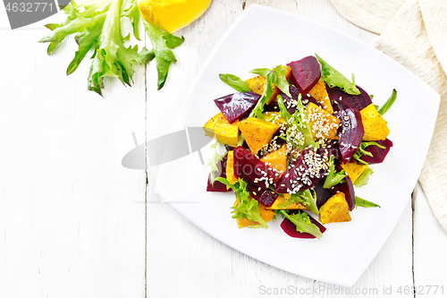 Image of Salad of pumpkin and beetroot in plate on board top