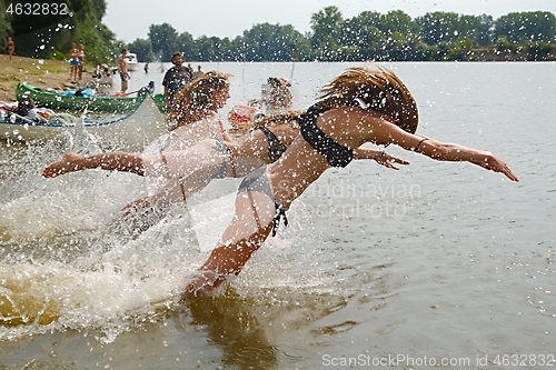 Image of Girls jumping in the river