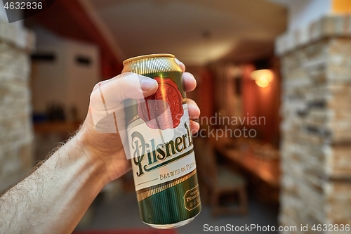 Image of Holding beer in a house