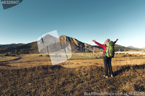 Image of Backpack woman enjoying the view