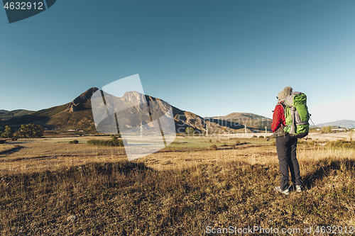 Image of Backpack woman enjoying the view