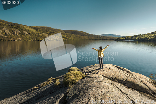 Image of Woman near a beautiful lake