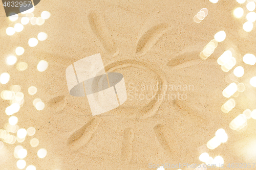 Image of picture of sun in sand on summer beach