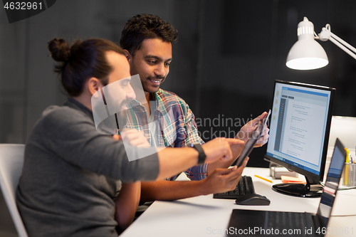 Image of creative team with tablet pc working at office