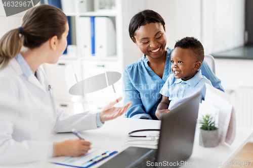 Image of happy mother with baby son and doctor at clinic