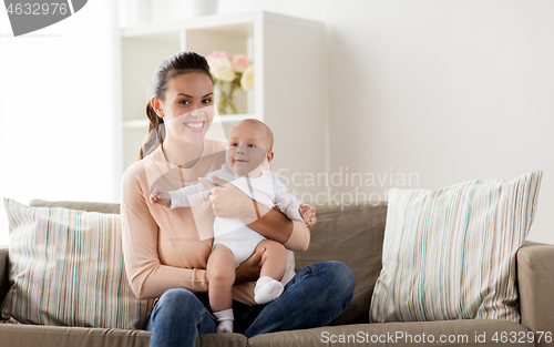 Image of happy mother with little baby boy at home